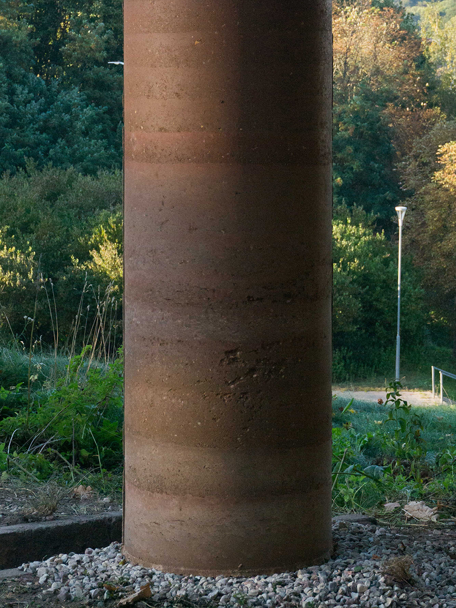 Close-up view of the rammed earth column
