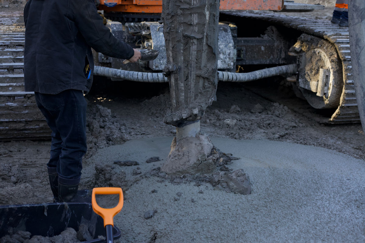 Photo of a person sourcing raw materials from a construction site.